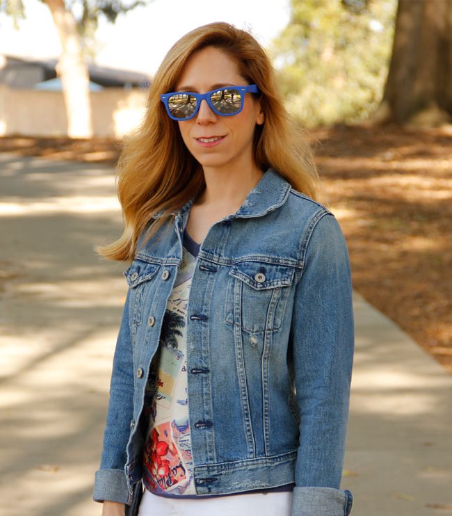 LA fashion blogger The Key To Chic wears an AG Jeans jacket, Peter Som for Kohl's postcard print sweatshirt, white Gap jeans, and Kate Spade Penny bag