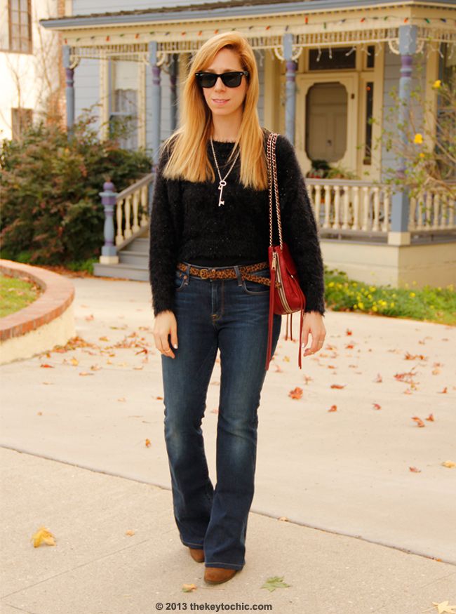 LA fashion blogger The Key To Chic wears a fuzzy Boohoo sweater with Charlotte flare Lucky Brand jeans and a Rebecca Minkoff Swing bag