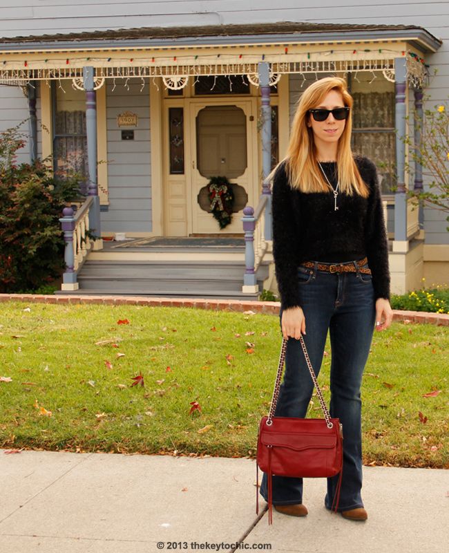 LA fashion blogger The Key To Chic wears a fuzzy Boohoo sweater with Charlotte flare Lucky Brand jeans, Charlotte Russe midi rings, and a Rebecca Minkoff Swing bag