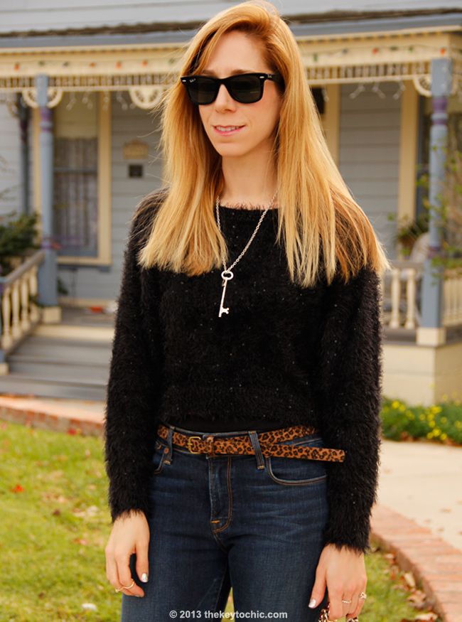 LA fashion blogger The Key To Chic wears a fuzzy Boohoo sweater with Charlotte flare Lucky Brand jeans and a Rebecca Minkoff Swing bag