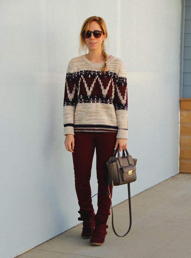 LA fashion blogger The Key To Chic wears a Forever 21 festive folk sweater with corduroy jeans, a Phillip Lim for Target taupe mini satchel, and Xhilaration Kahsha wedge sneakers.