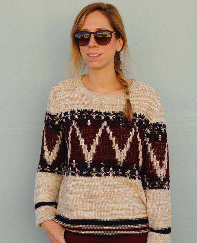 LA fashion blogger The Key To Chic wears a Forever 21 festive folk sweater with corduroy jeans, a Phillip Lim for Target mini satchel in taupe, and Xhilaration Kahsha wedge sneakers.
