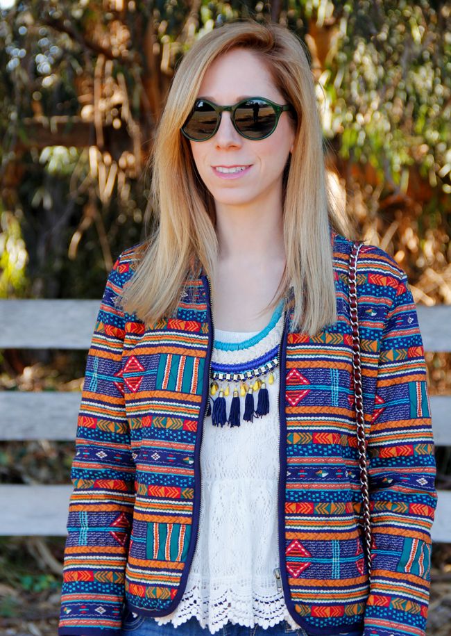 LA fashion blogger The Key To Chic wears a tassel necklace, quilted Forever 21 eclectic print jacket, peplum lace top, and Warby Parker Quimby Sunglasses in Absinthe