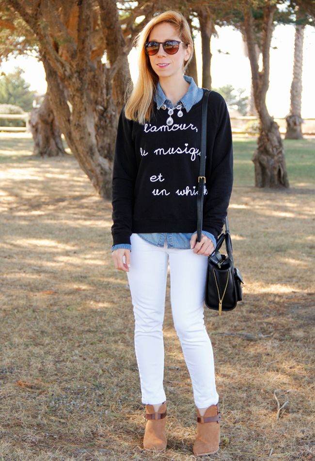 Los Angeles fashion blogger The Key To Chic wears a BoBo House whisky graphic sweater, white Gap jeans, and Rag & Bone Harrow boots in camel