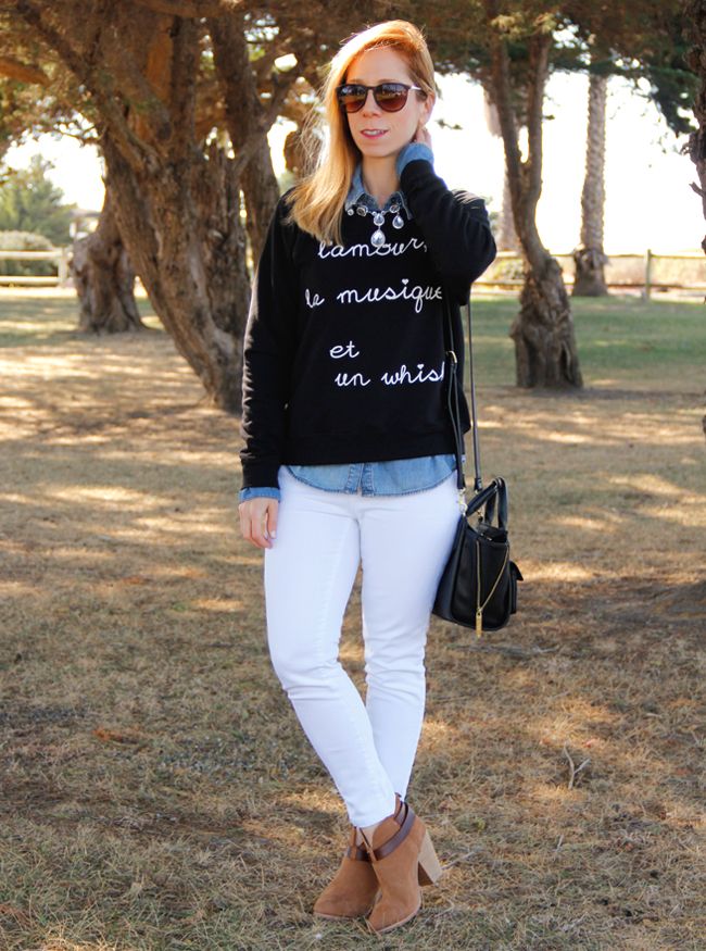 Los Angeles fashion blogger The Key To Chic wears a BoBo House whisky graphic sweater, white Gap jeans, and Rag & Bone Harrow boots in camel
