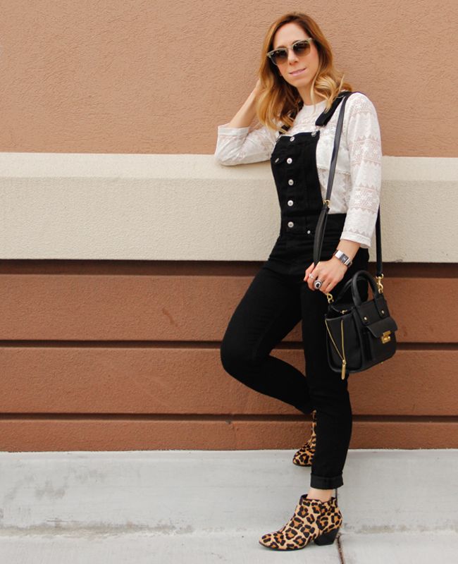 Fashion blogger The Key To Chic wears a white lace blouse with black overalls and Topshop leopard print ankle boots.