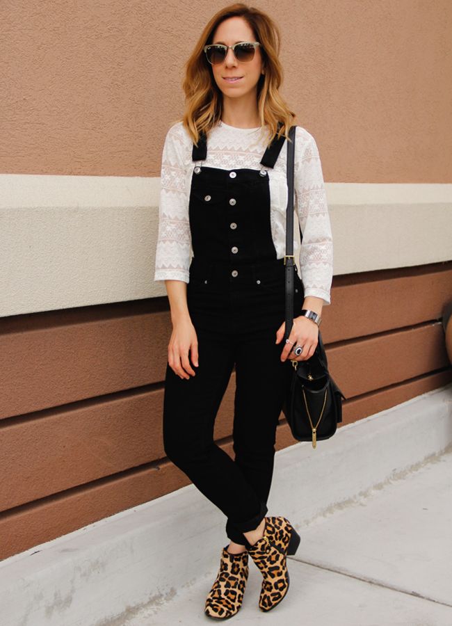 Fashion blogger The Key To Chic wears a white lace blouse with black overalls and Topshop leopard print ankle boots.