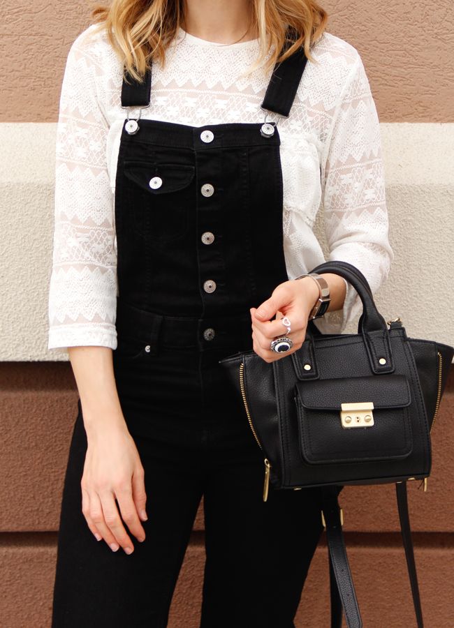 Fashion blogger The Key To Chic wears a white lace blouse with black overalls and Topshop leopard print ankle boots.