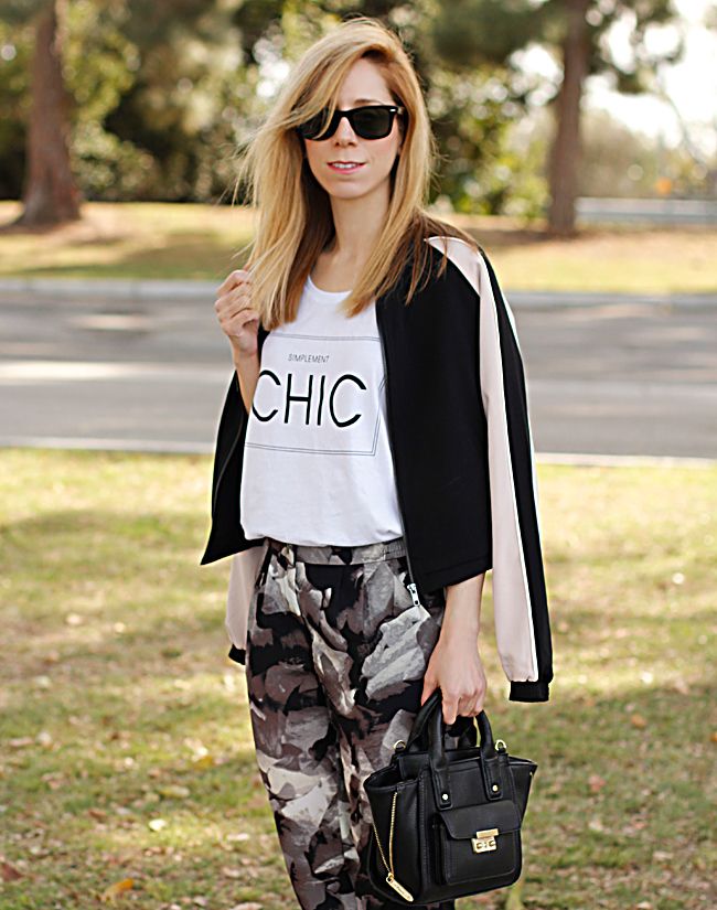 LA fashion blogger The Key To Chic wears Mossimo floral drapey trousers, Mossimo Kacie boots, a black Phillip Lim for Target mini satchel, and a Mossimo colorblock bomber jacket
