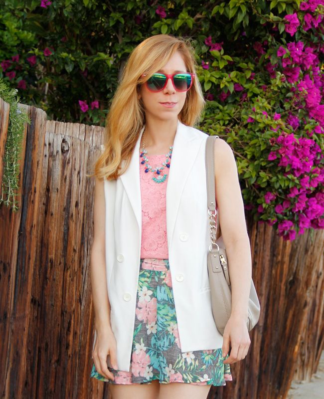 LA fashion blogger The Key To Chic wears an Xhilaration tropical print skirt from Target with a Kate Spade bag and J Crew statement necklace