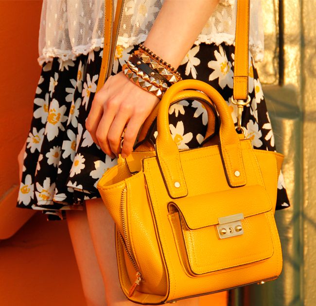 LA fashion blogger The Key To Chic wears an Xhilaration daisy print scooter from Target, a Free People lace blouse, and a Phillip Lim for Target mini satchel