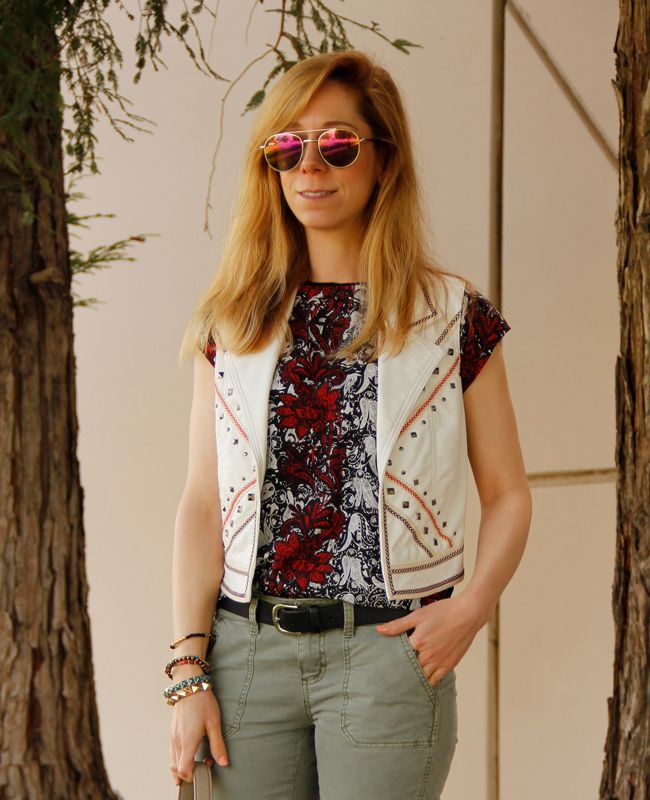 LA fashion blogger The Key To Chic wears a faux leather Southwestern vest with Mossimo moto pants, and a Kate Spade Penny bag.