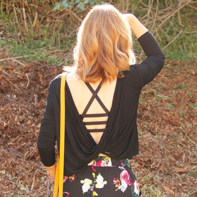 Fashion blogger The Key To Chic wears a twist back top, Forever 21 cage sports bra, and Merona floral pants