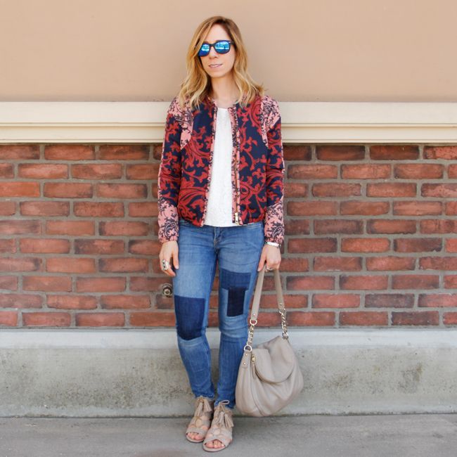 Fashion blogger The Key To Chic wears a quilted H&M bomber jacket with patchwork skinny jeans, Kate Spade Little Penny bag, and Sam & Libby 'Arianna' sandals