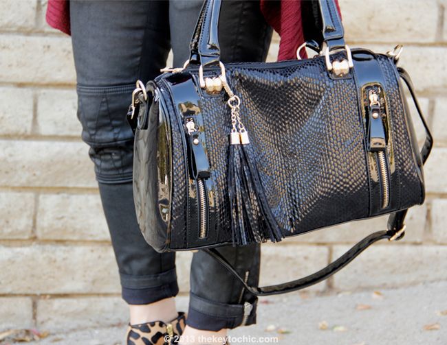 L.A. fashion blogger The Key To Chic wears an Isabel Marant for H&M white T-shirt and black waxed biker jeans with a Mellow World Ethel handbag, and Charlotte Russe oxblood waterfall cardigan