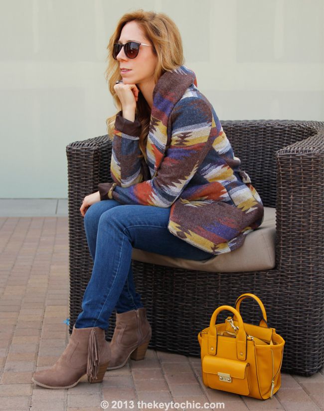 L.A. fashion blogger The Key To Chic wears Old Navy Rockstar jeans,a Phillip Lim for Target mini satchel, a Mossimo wrap coat, and Wet Seal fringe boots.