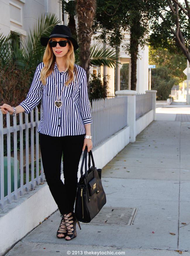 Los Angeles fashion blogger The Key To Chic wears a striped blouse from AMI Clubwear, J Brand skinny jeans, a Boohoo hat, Zara lace-up heels, and a Phillip Lim for Target tote bag