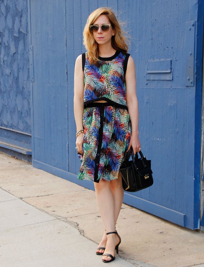L.A. fashion blogger The Key To Chic wears a matching tropical print crop top and skirt from Sense of Style boutique with ankle strap heels and a Phillip Lim for Target mini satchel.