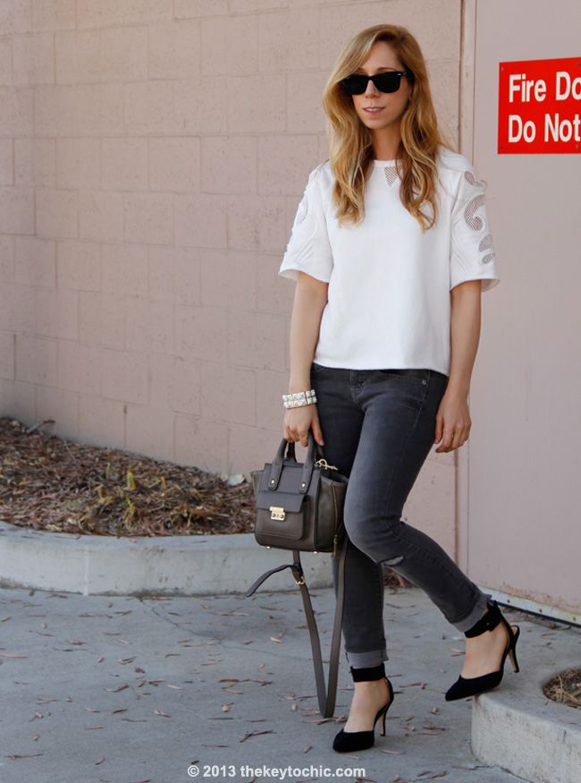 embellished sweatshirt from Crossroads Trading, Mossimo skinny jeans, Luichiny Law Rence heels, and Phillip Lim for Target taupe mini satchel