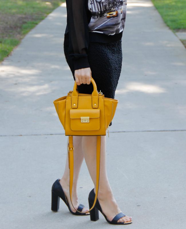 LA fashion blogger The Key To Chis wears an Elie Tahari for Kohl's georgette taxi top with a lace pencil skirt and Boohoo heels.