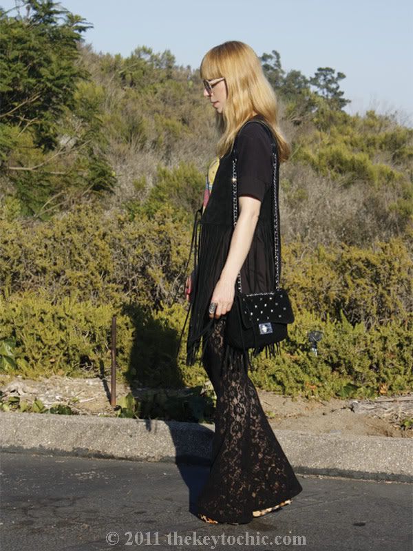 Suede fringe vest, lace bell bottoms, studded bag, Steve Madden Wicked leopard wedges, Los Angeles fashion blog
